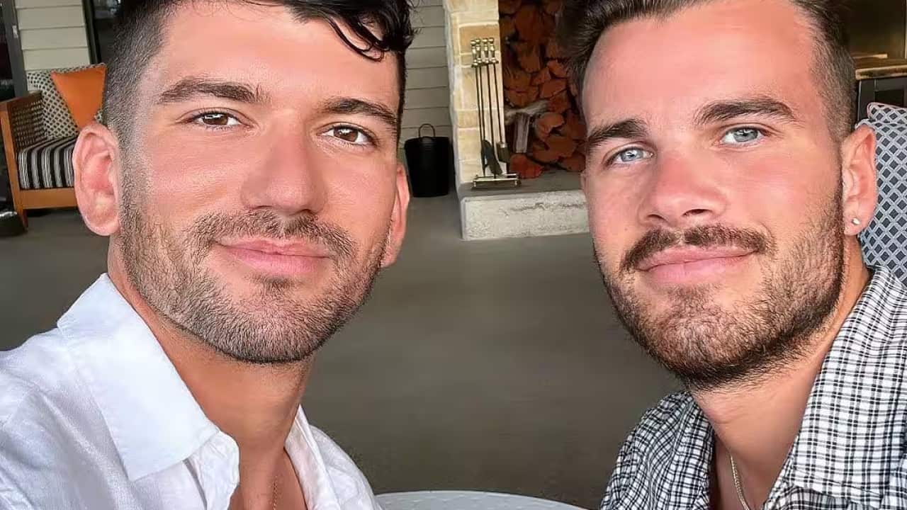 Two men pose for a selfie_.png