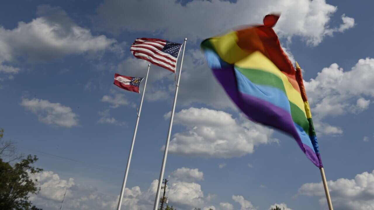 A rainbow flag is waved during a rally at the John H. Ruffin, Jr., Courthouse in Augusta, Ga., on Friday, June 26, 2015. (Jon-Michael Sullivan/AP)