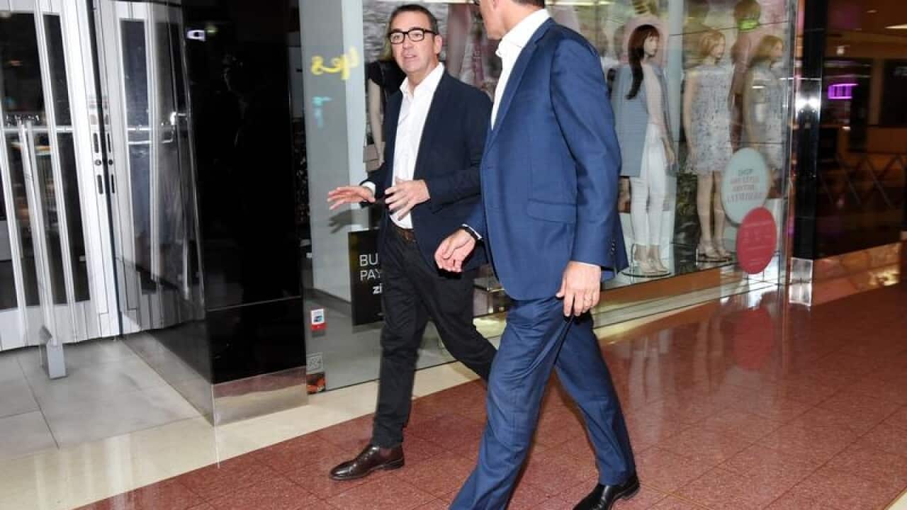 File image of Steven Marshall walks through a closed shopping centre.
