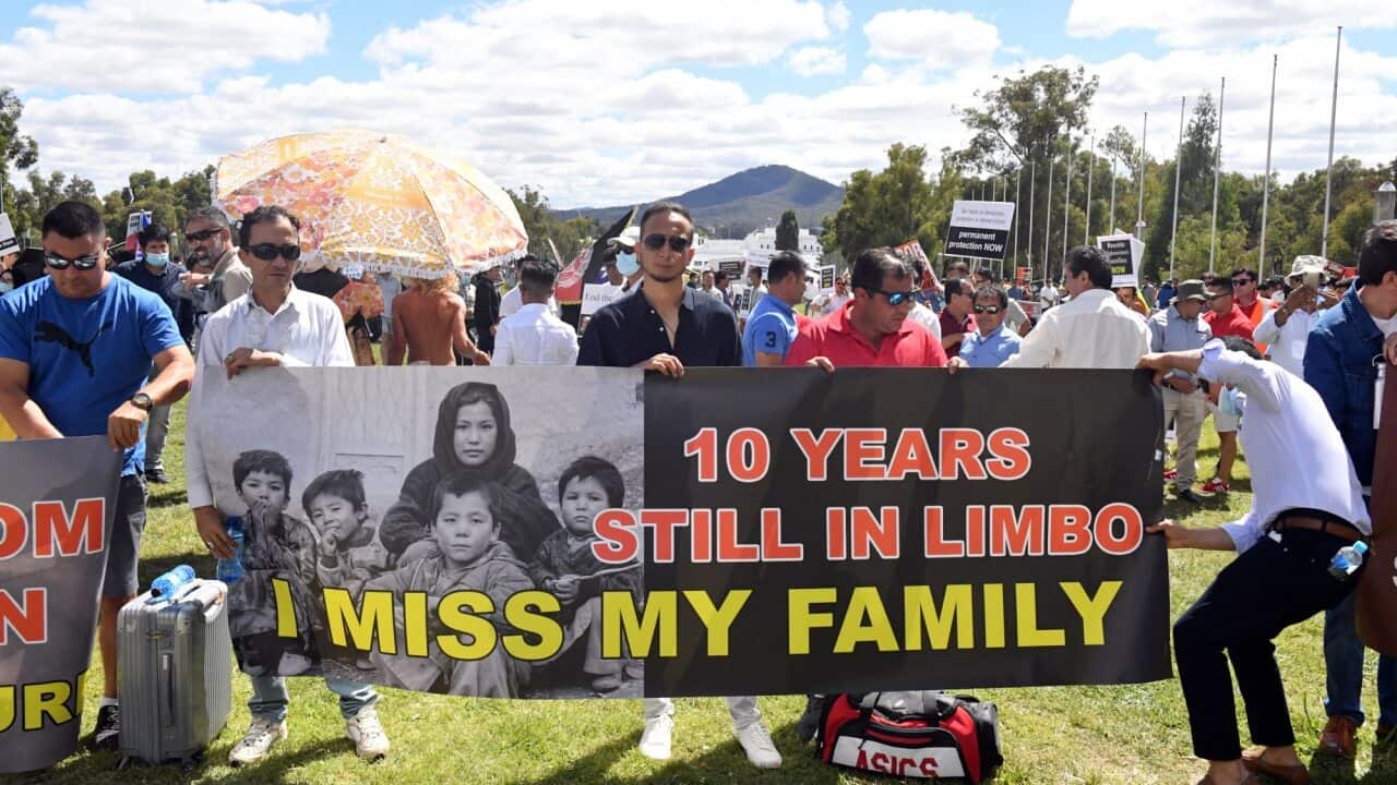 Refugees and people seeking asylum from Afghanistan rally outside Parliament House in Canberra