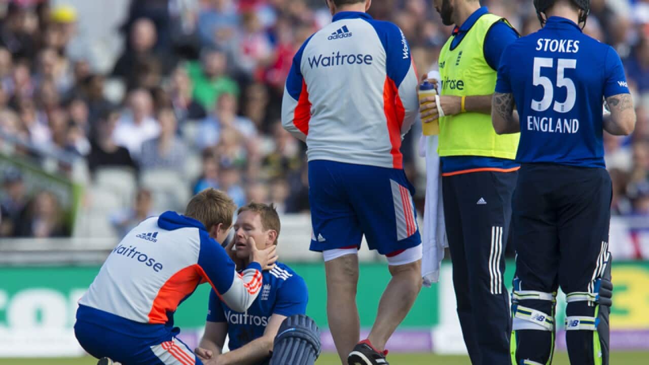 England's captain Eoin Morgan is treated.