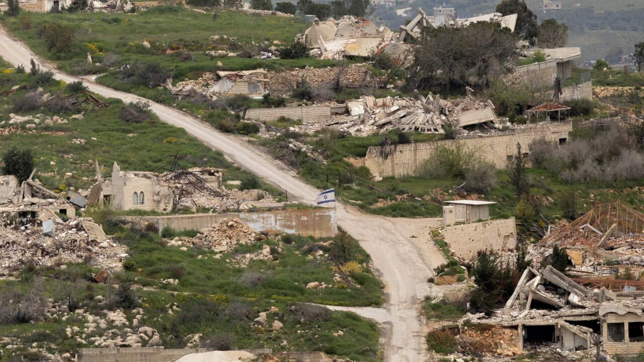 Aerial view of a country road and destroyed buildings