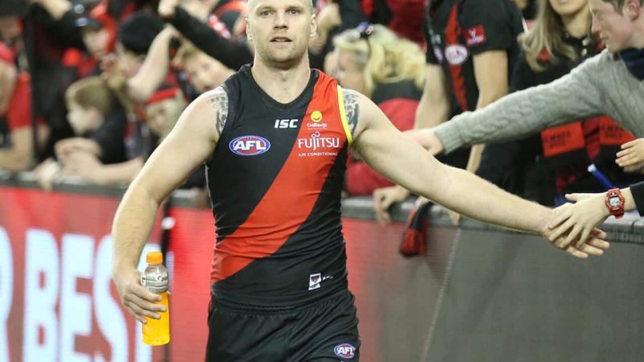Jake Stringer of the Bombers celebrates with fans.