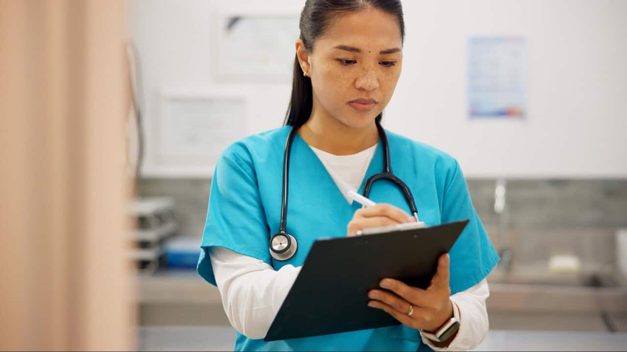 Asian woman, vet and writing with clipboard for results on animal medicine, study or diagnosis at clinic. Young female person or veterinarian taking notes for medical prescription or pet treatment