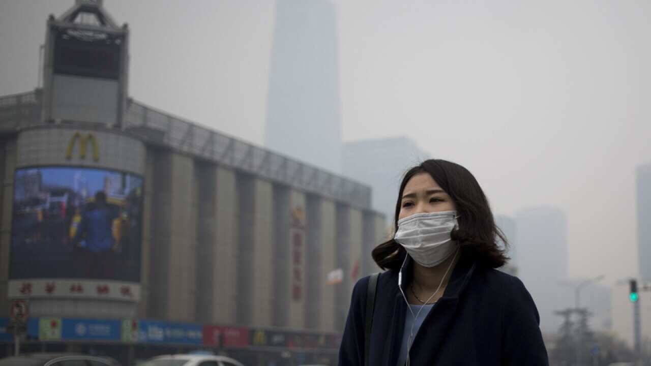 A Chinese woman with a mask in Beijing