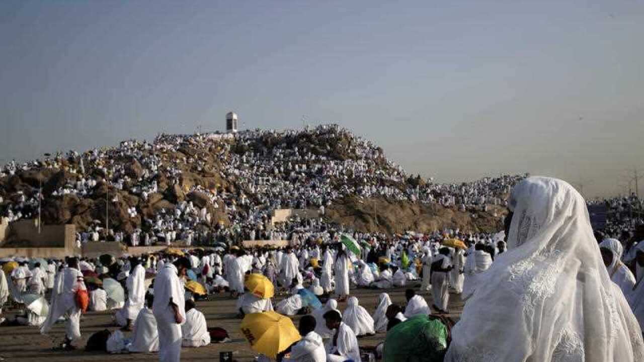 Muslim pilgrims pray on a rocky hill known as Mountain of Mercy, on the Plain of Arafat, during the annual hajj pilgrimage near the holy city of Mecca