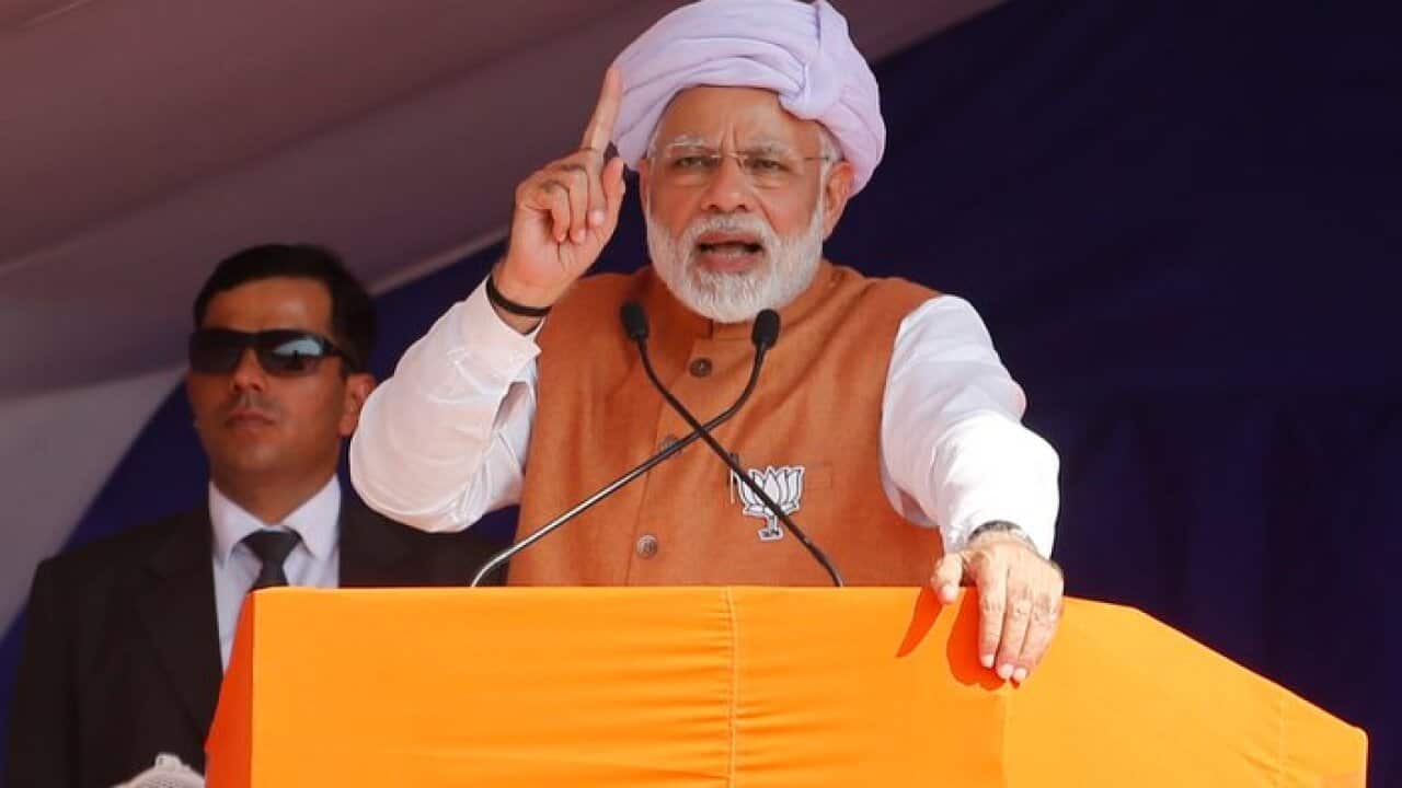 Indian Prime Minister Narendra Modi speaks during an election campaign rally at Jasdan in Gujarat, India, Monday, Nov. 27, 2017.
