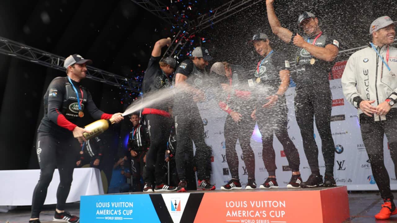 Sir Ben Ainslie celebrates with the Land Rover BAR team