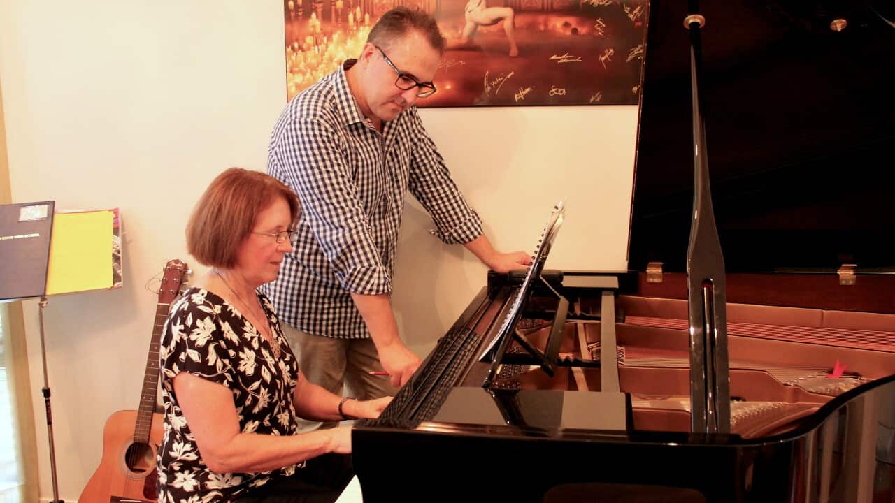 Greg and Renate during piano lesson