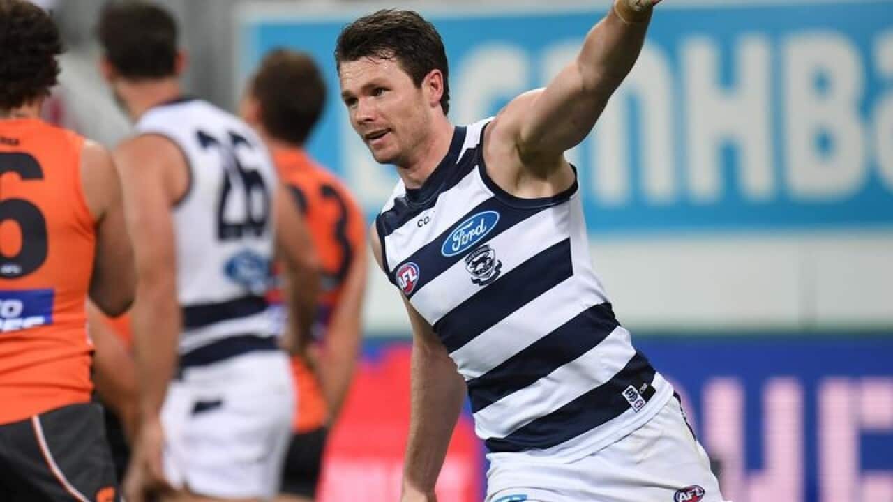 Patrick Dangerfield of the Cats reacts after kicking a goal.
