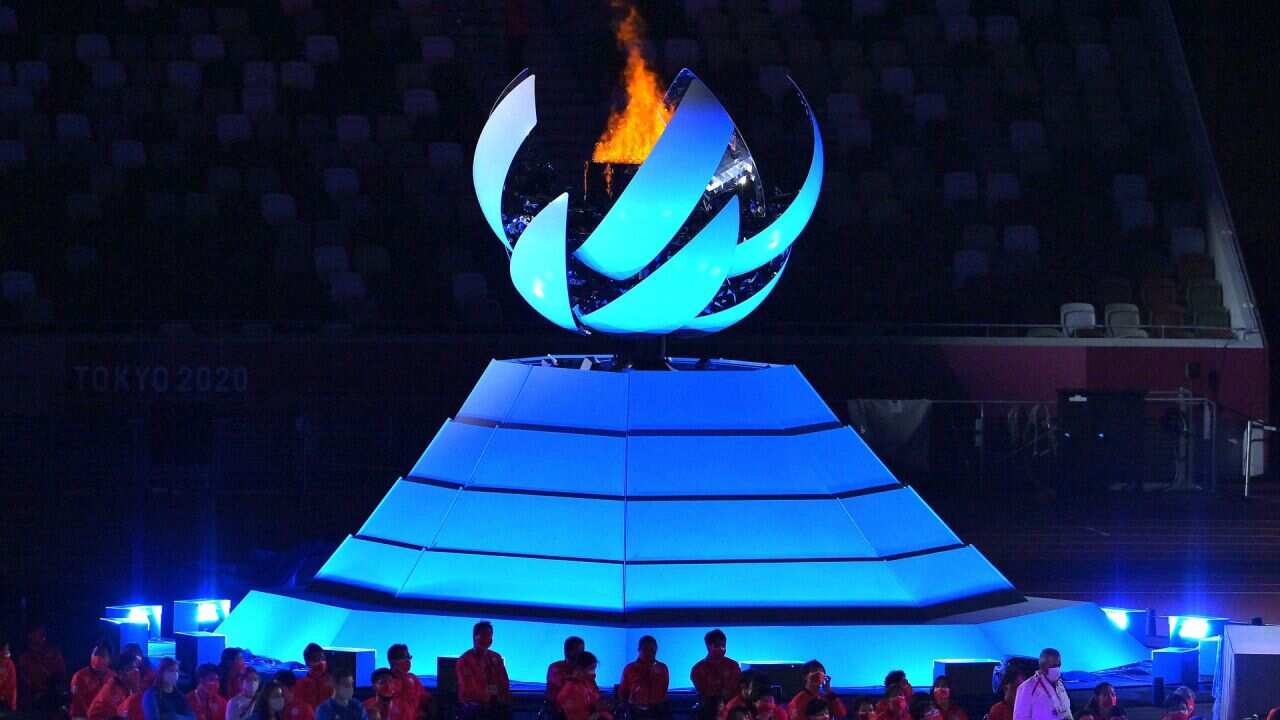 The Paralympic Flame glows at the closing ceremony.