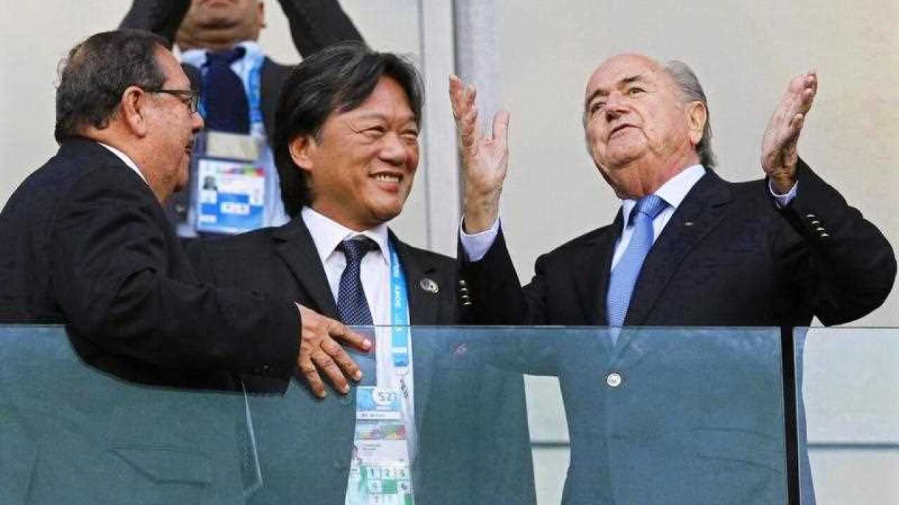 A file picture of then Costa Rican football federation president Eduardo Li and FIFA President Joseph Blatter before the FIFA World Cup 2014 round of 16 soccer match between Costa Rica and Greece at the Arena Pernambuco in Recife, Brazil