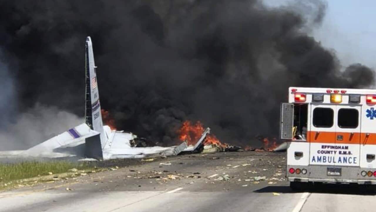 Flames and smoke rise from an Air National Guard C-130 cargo plane after it crashed near Savannah, Ga., Wednesday, May 2, 2018.