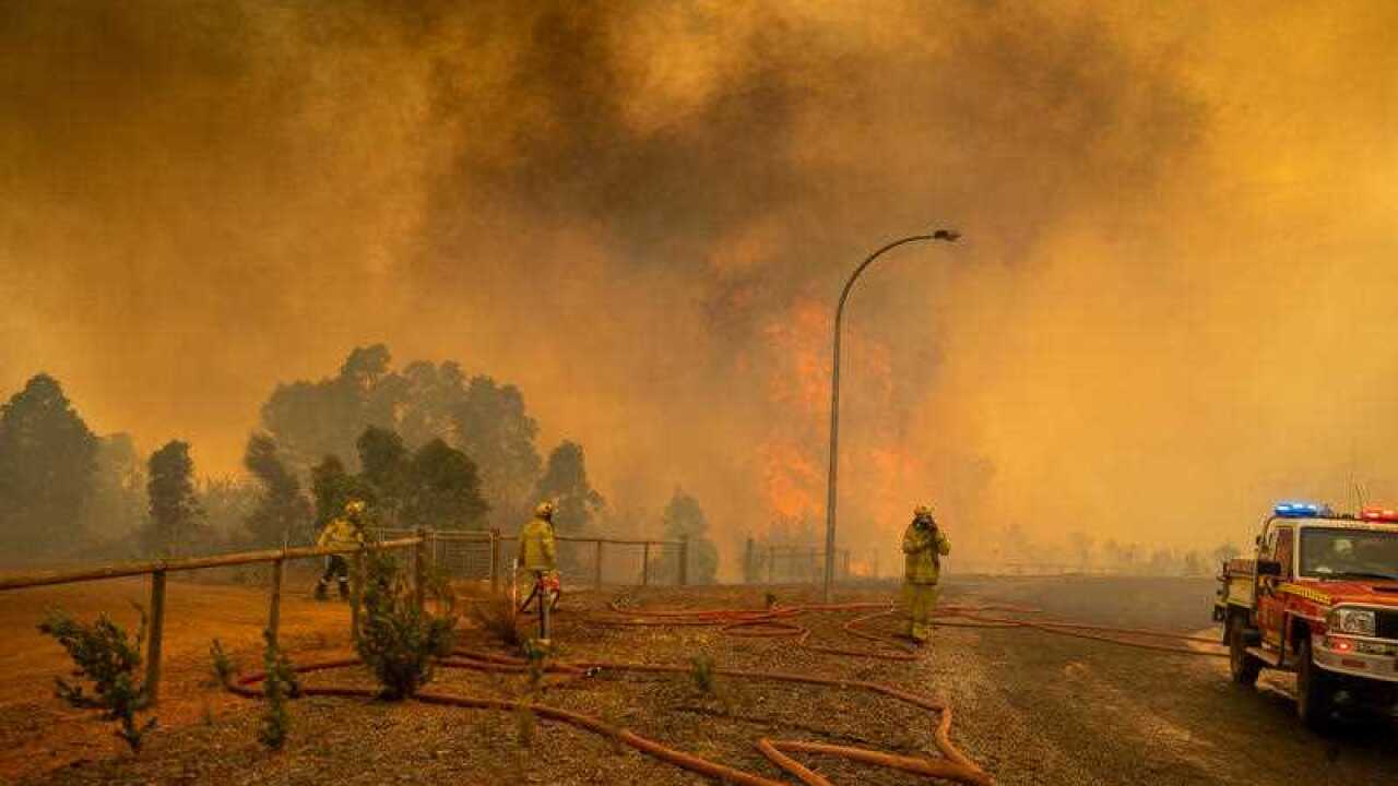 Fire fighters in Western Australia battling a blaze at Wooroloo, near Perth, on 2 February, 2021.