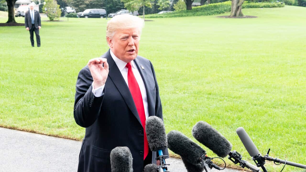 President Donald Trump stopped to speak with the press as he leaves the White House in Washington, DC