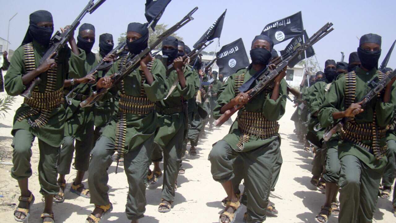 Al-Shabab fighters march with their weapons, Mogadishu, Somalia