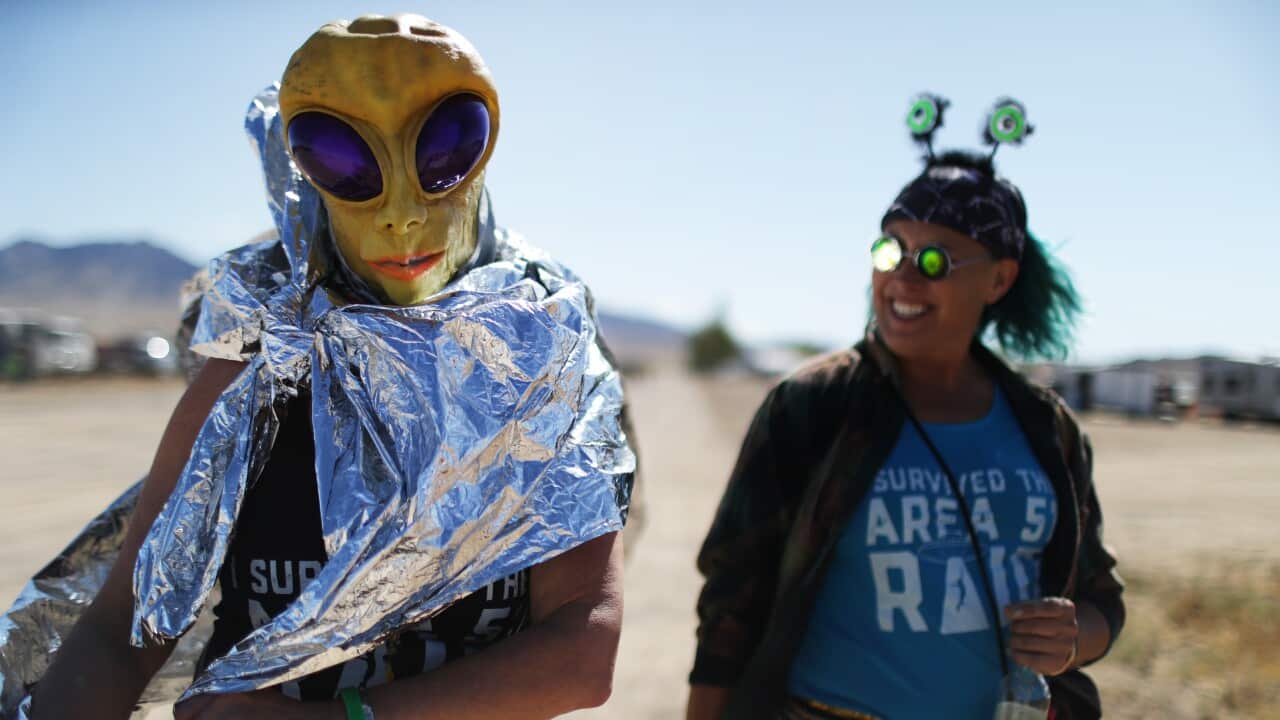Margaret Lemay (L) and Karen Peterson of Wisconsin gather at a 'Storm Area 51' spinoff event in Rachel, Nevada.