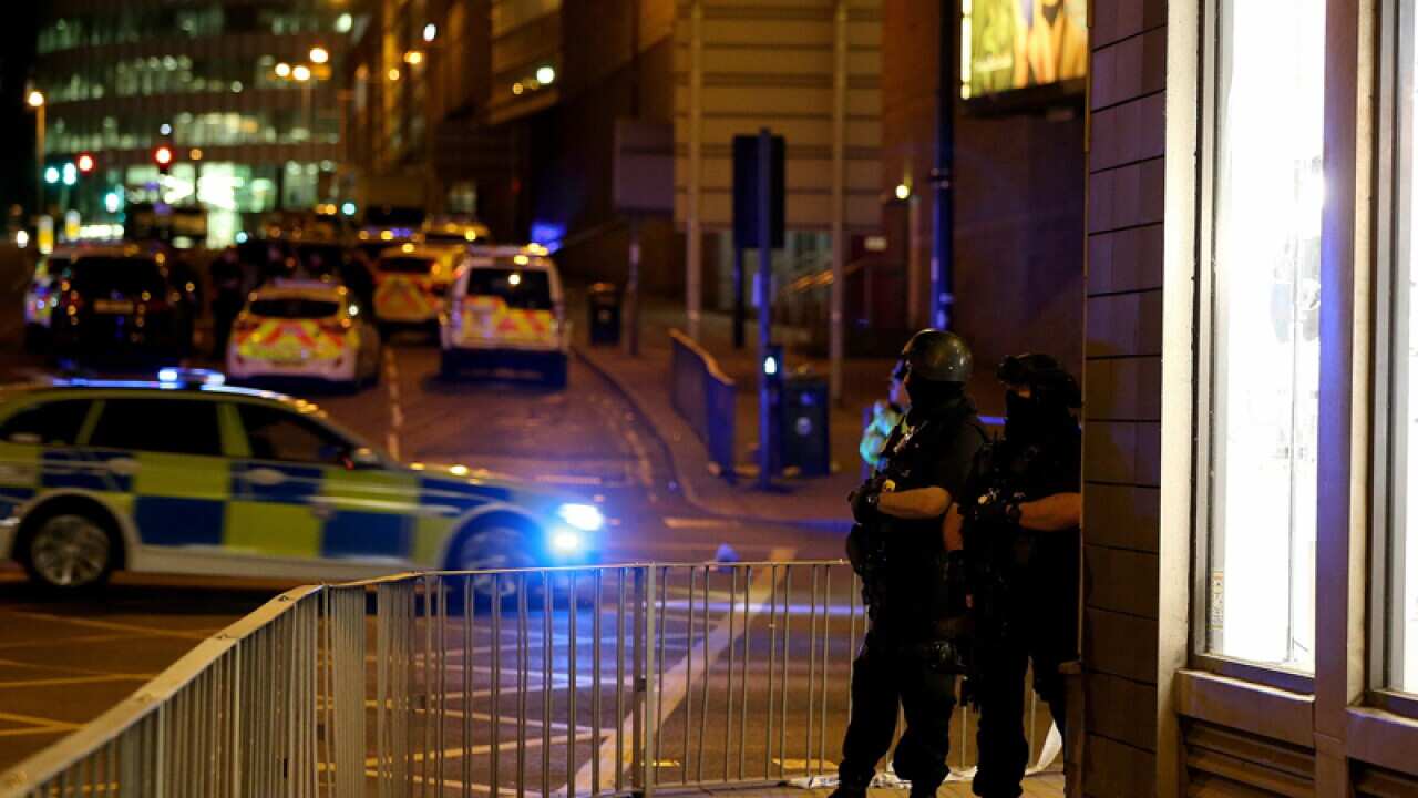 Armed police near the scene of an explosion in Manchester