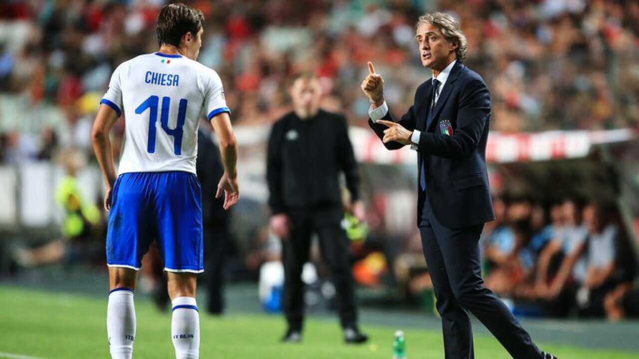Italy manager Roberto Mancini shouts instructions to Italy's Federico Chiesa during the UEFA Nations League.