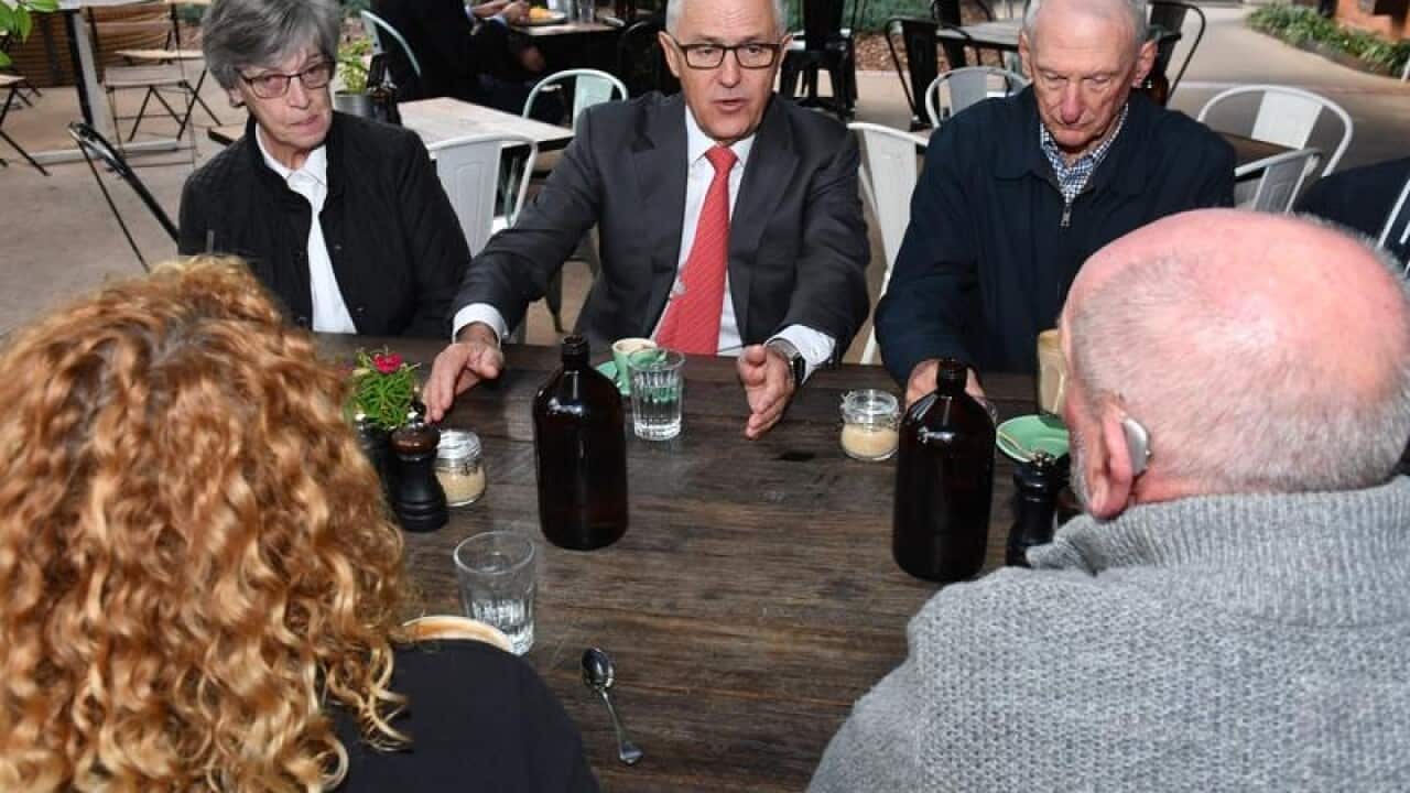 Malcolm Turnbull meets with pensioners at a coffee shop in Canberra.