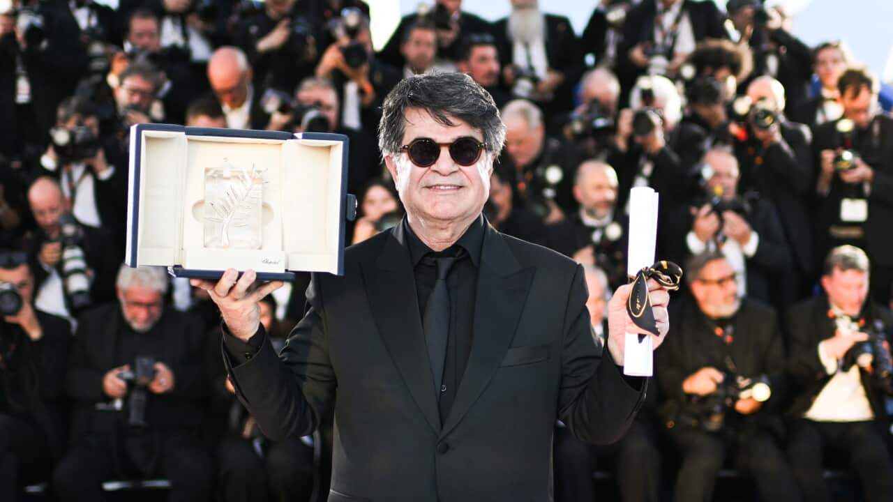 Jafar Panahi poses with the Palme D'Or award for "It Was Just an Accident" during the Palme D'Or Winners photocall in Cannes, France on May 24, 2025