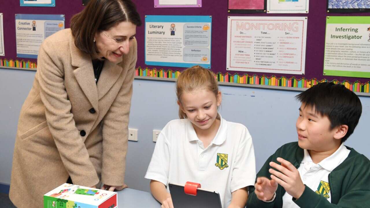 Gladys Berejiklian talks to school students in a classroom