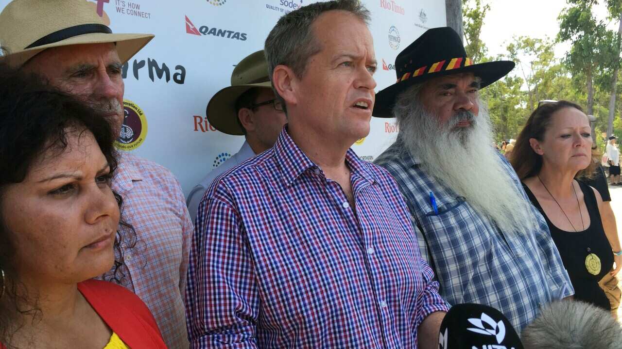 Labor leader Bill Shorten (centre) addresses the media at Garma Festival with Senator Malarndirri McCarthy (left), Warren Snowdon, Senator Pat Dodson (right).