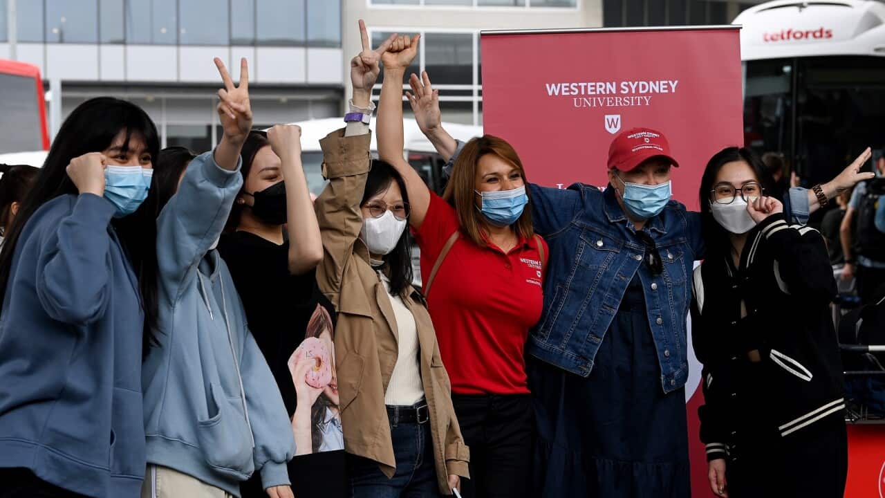 International students at Western Sydney University pose for a photograph