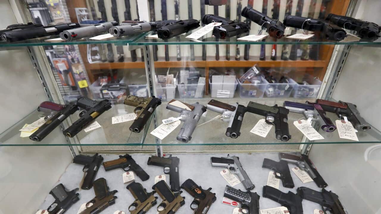 Semi-Automatic handguns are displayed at Duke's Sport Shop, Wednesday, March 25, 2020, in New Castle, Pa. (AP Photo/Keith Srakocic)