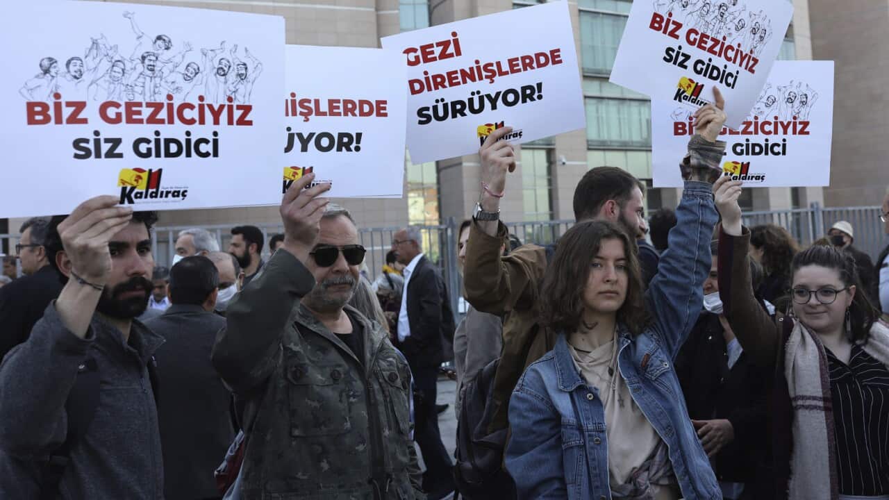 Protesters outside the court in Istanbul, with messages to President Erdogan saying 'You will go'