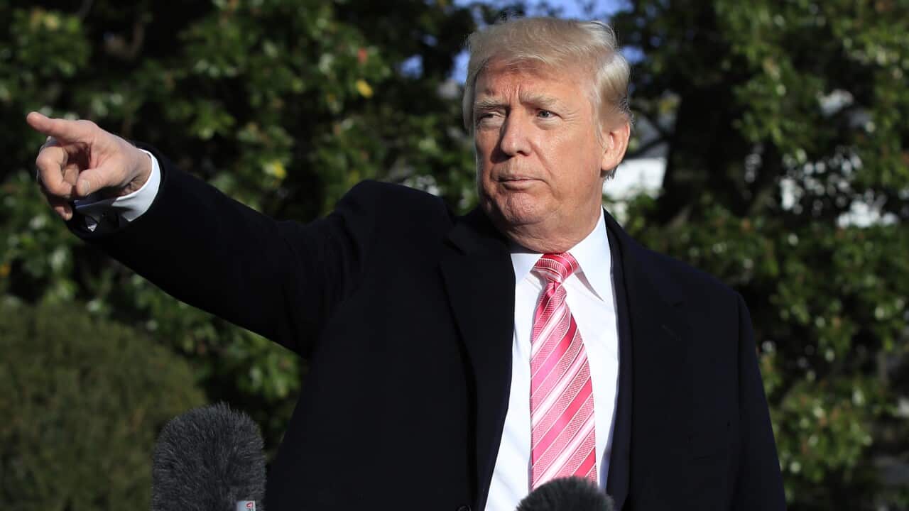 President Donald Trump points to reporters after speaking at the White House, Tuesday, Nov. 21, 2017, in Washington, as he and his family were leaving for a Thanksgiving trip to his Mar-a-Lago estate in Palm Beach, Fla. (AP Photo/Manuel Balce Ceneta)
