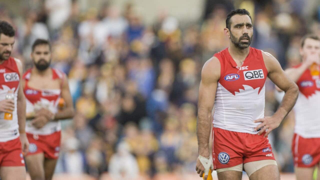 Adam Goodes leads his team from the field after their loss