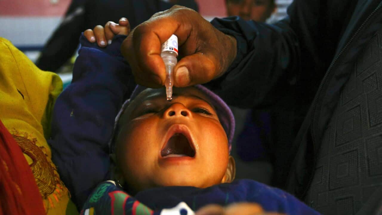 Nepali child receives polio vaccination