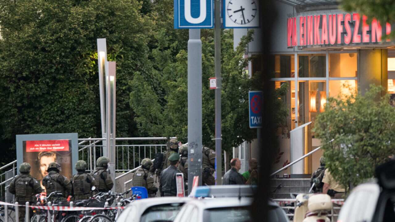 Special forces police enter the Olympia mall in Munich