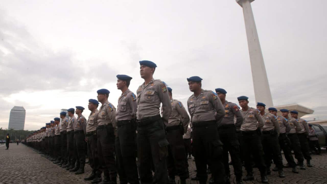 Indonesian police officers line up during a drill at the National Monument in Jakarta, Indonesia, 21 December 2017.