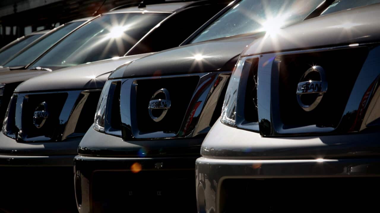Nissan cars sit at a car yard