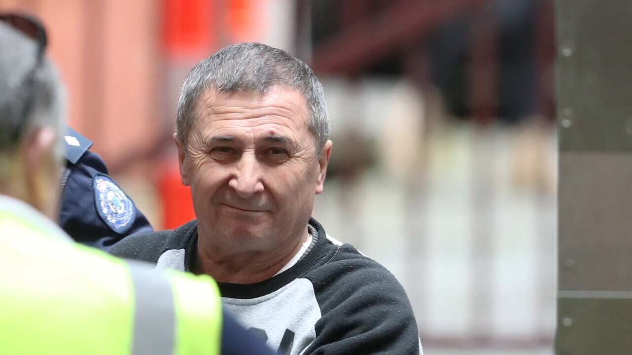 Mehmed Solmaz is taken into the Victorian Supreme court in Melbourne