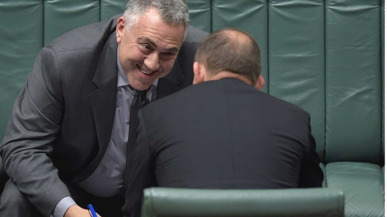 Treasurer Joe Hockey (left) speaks to Prime Minister Tony Abbott
