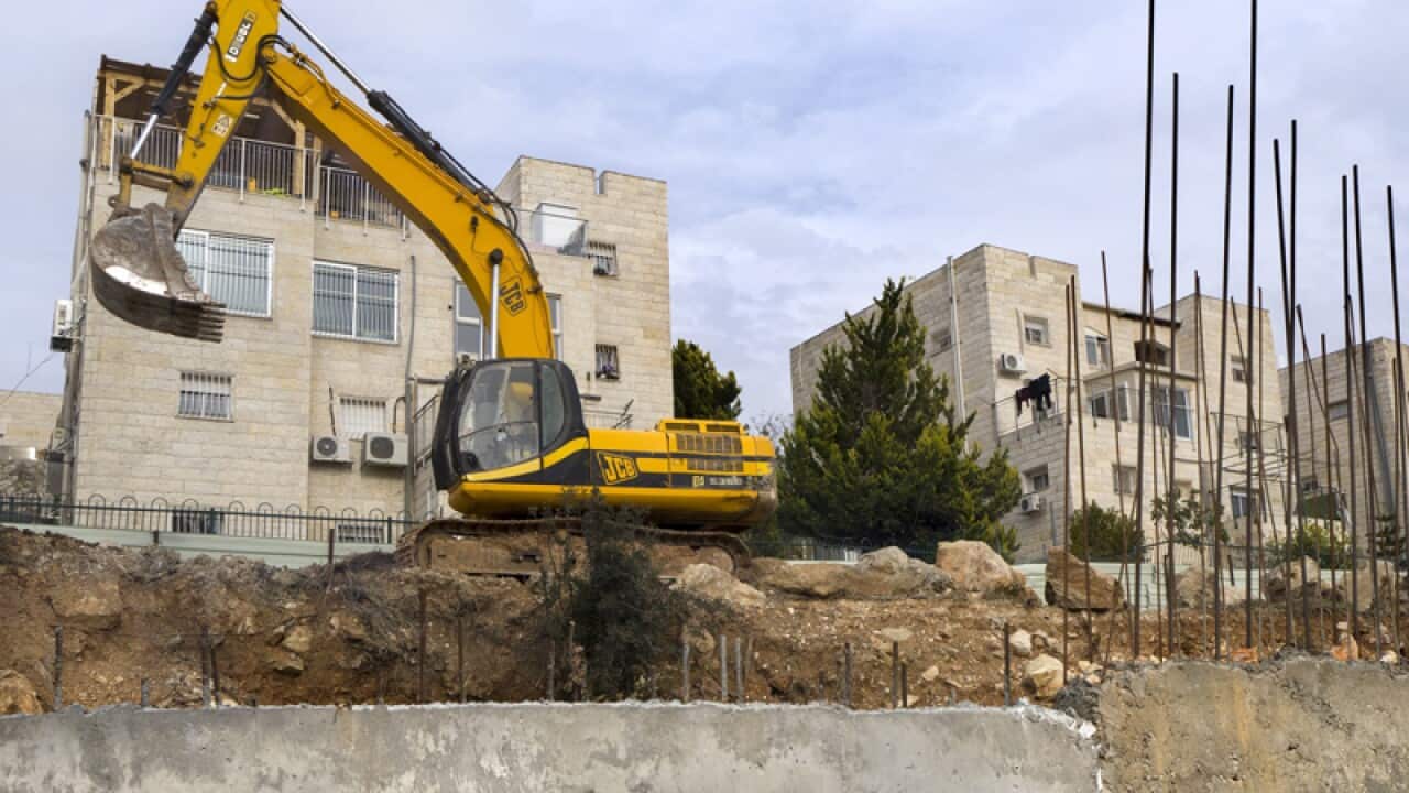 Earth moving equipment in the disputed 'settlement' of Ramat Shlomo