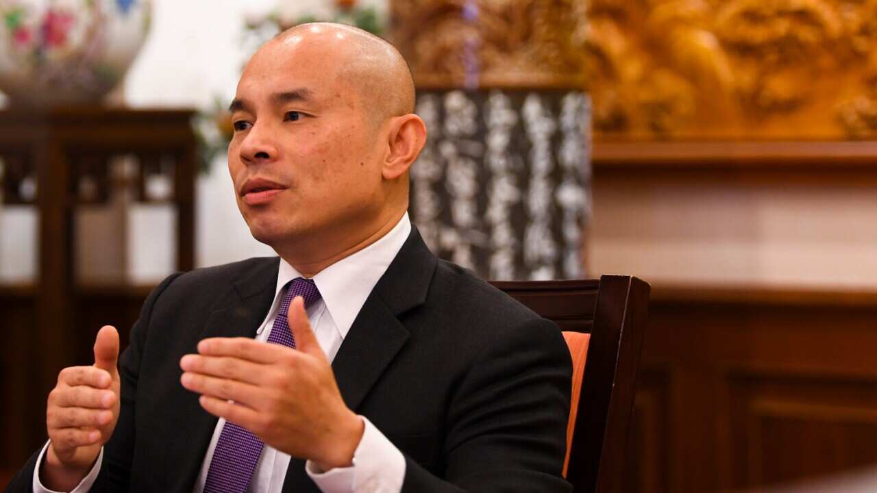 The Deputy Head of Mission of the Chinese Embassy in Australia, Wang Xining.