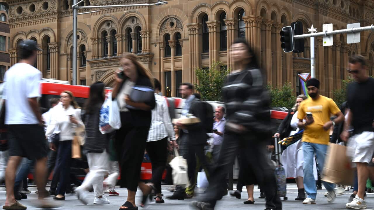 Pedestrians walking on a street.
