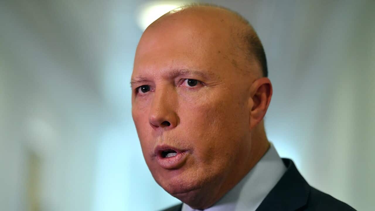 Minister for Home Affairs Peter Dutton talks to the media on Tuesday.
