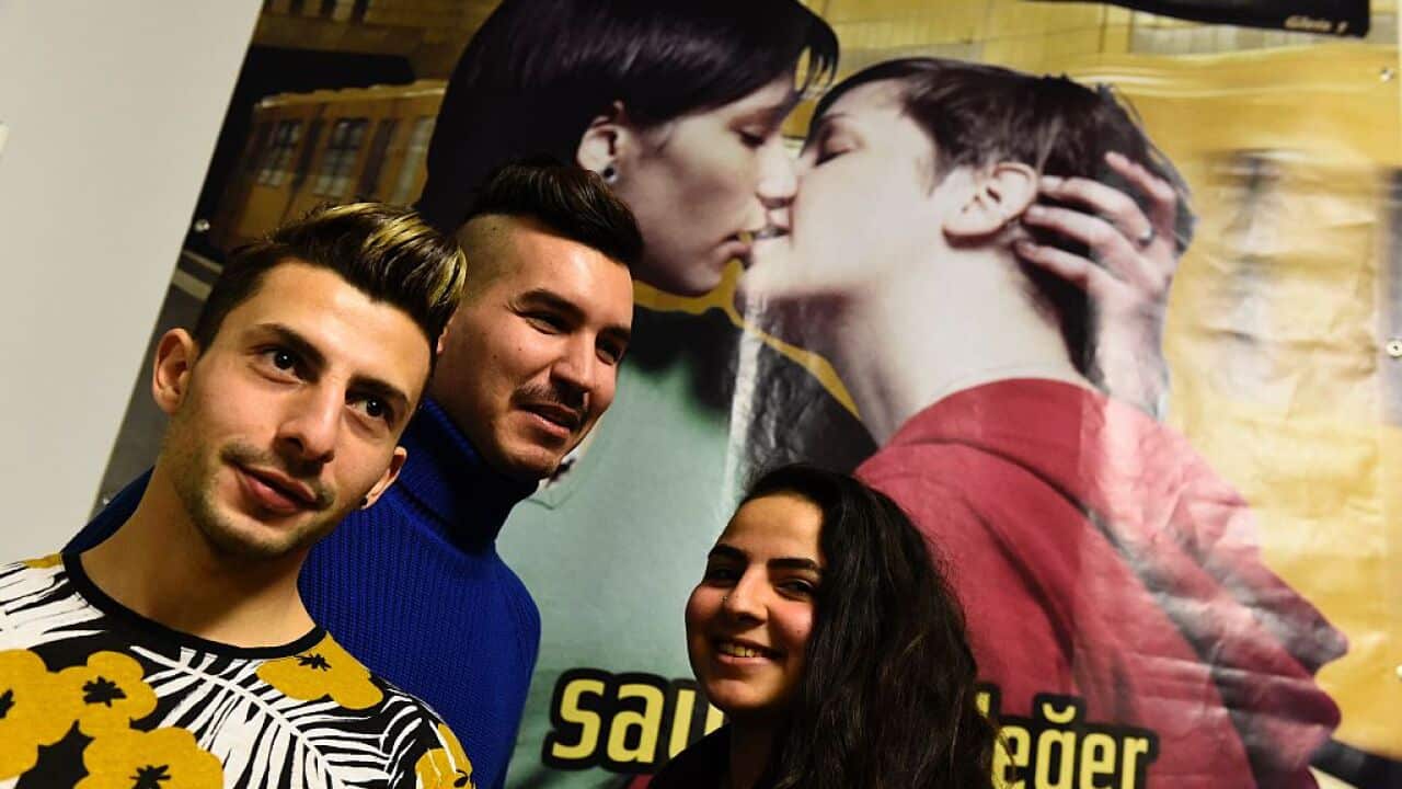 Syrian migrants Steve, Auz and Enana after a news conference with Berlin's Lesbian and Gay Union in January 2016, the city's Archbishop was also present.