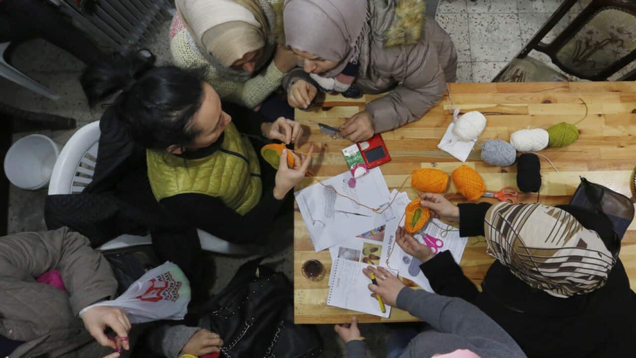Syrian refugees attend a knitting lesson in Istanbul.