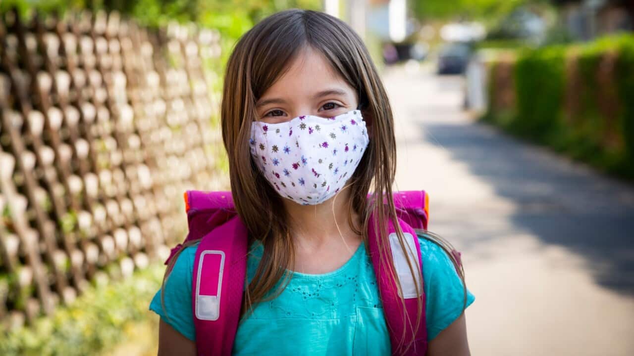 Girl wears pretty mask