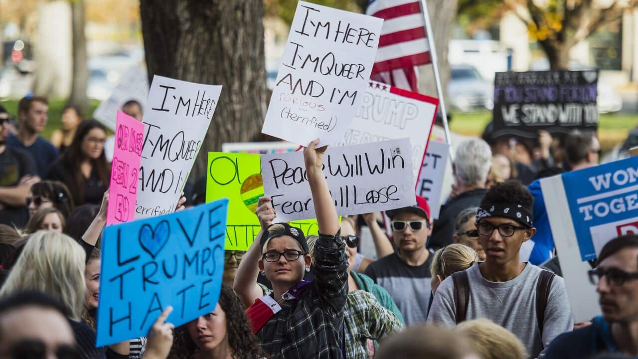 Protesters rally during a "Protests Trump" event in Salt Lake City on Saturday, Nov. 12, 2016