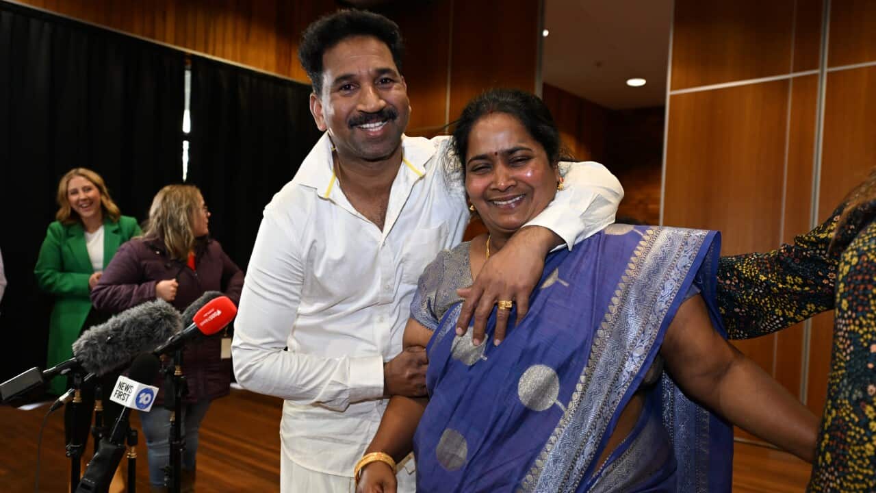 Nadesalingam parents Nades and Priya smiling