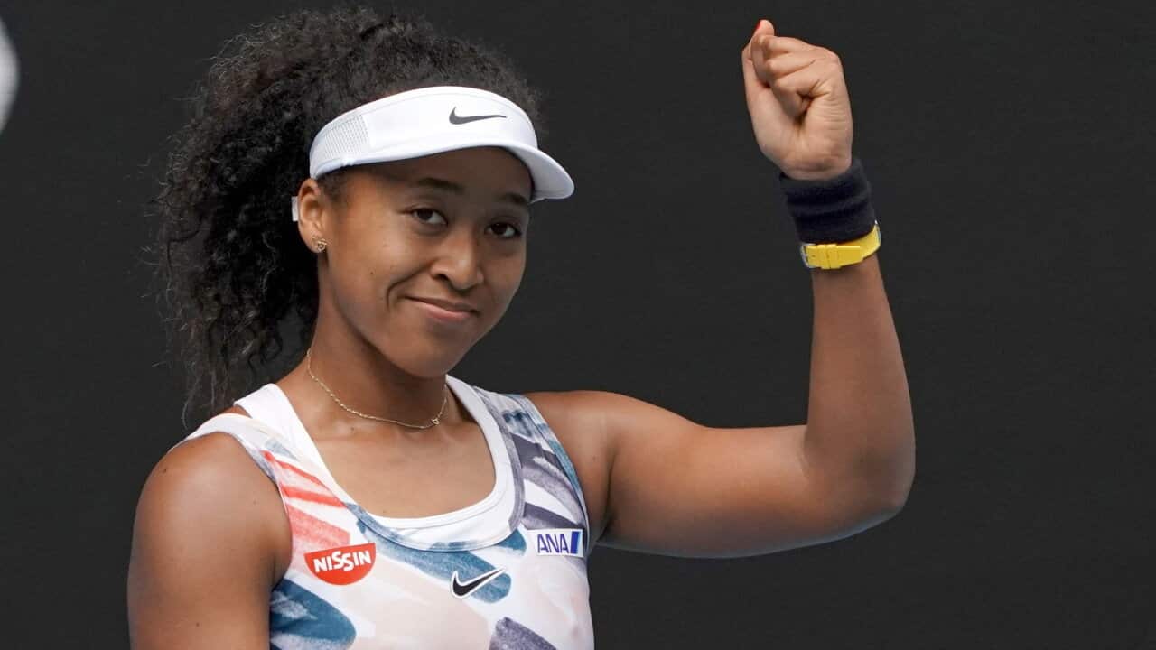 Japan's Naomi Osaka celebrates after defeating Marie Bouzkova of the Czech Republic in their first round singles match the Australian Open tennis championship in Melbourne, Australia, Monday, Jan. 20, 2020. (AP Photo/Lee Jin-man)