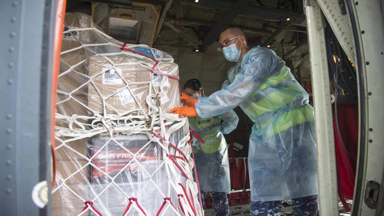 A team of AUSMAT nurses, doctors and emergency care specialists depart for Port Moresby, PNG, at the RAAF Base in Darwin, Friday, 9 April, 2021.