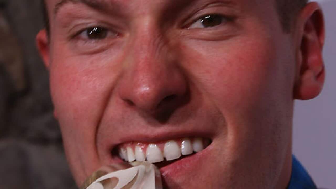 david_moeller_biting_medal_100219_getty_B_509690173